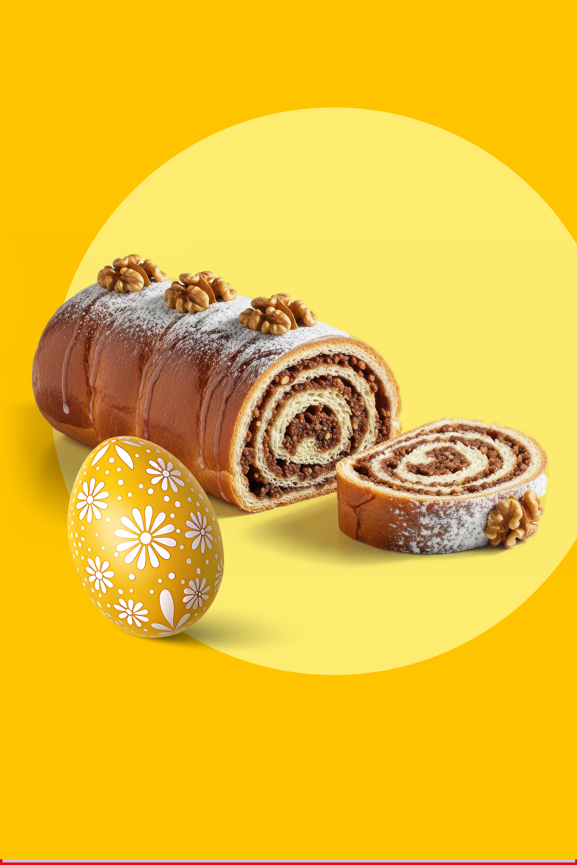 Potica z orehi in velikonočno jajce na rumenem ozadju.