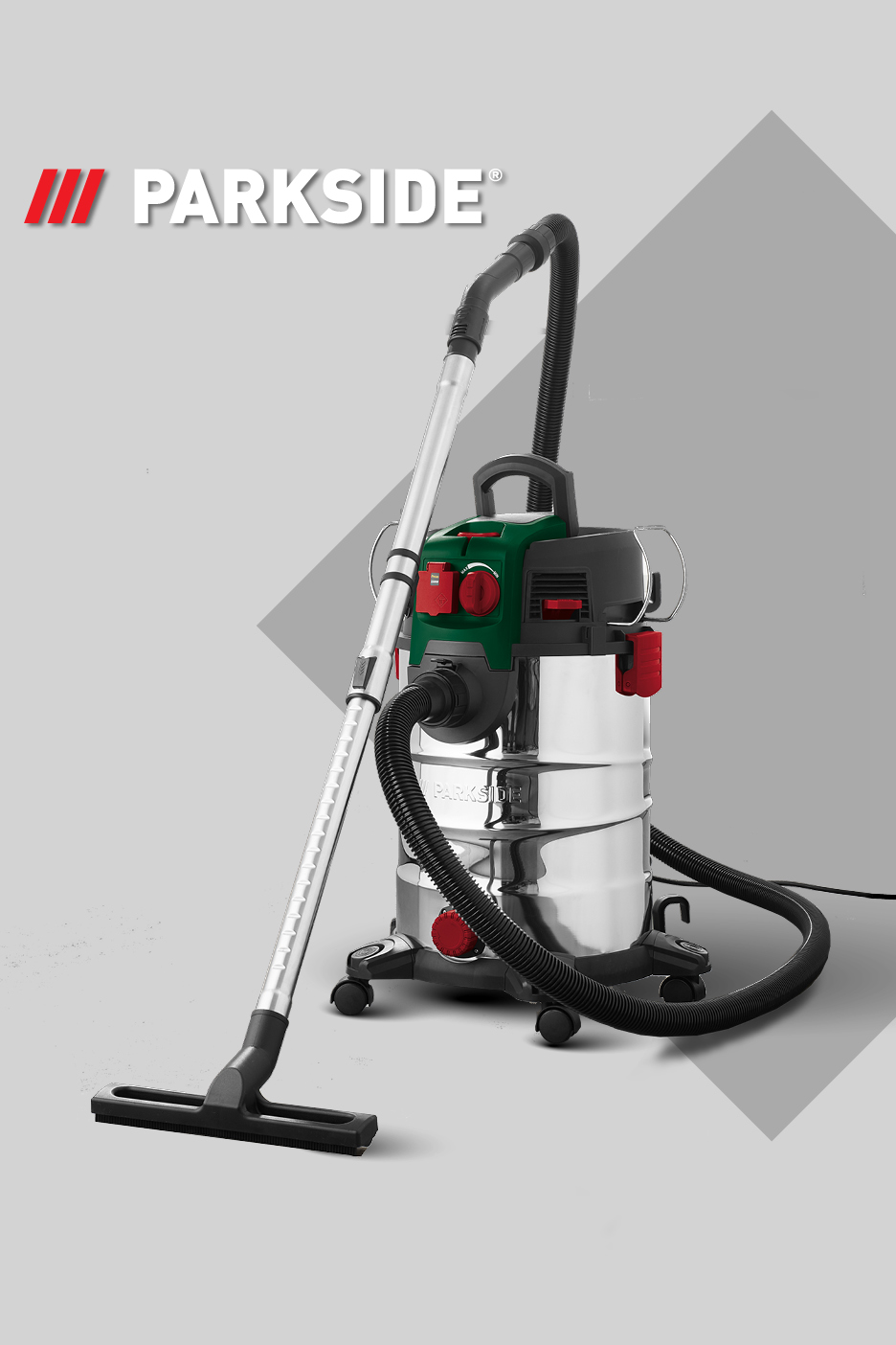 Industrijski sesalnik z nastavkom za tla in gibljivo cevjo na svetlo sivi podlagi.