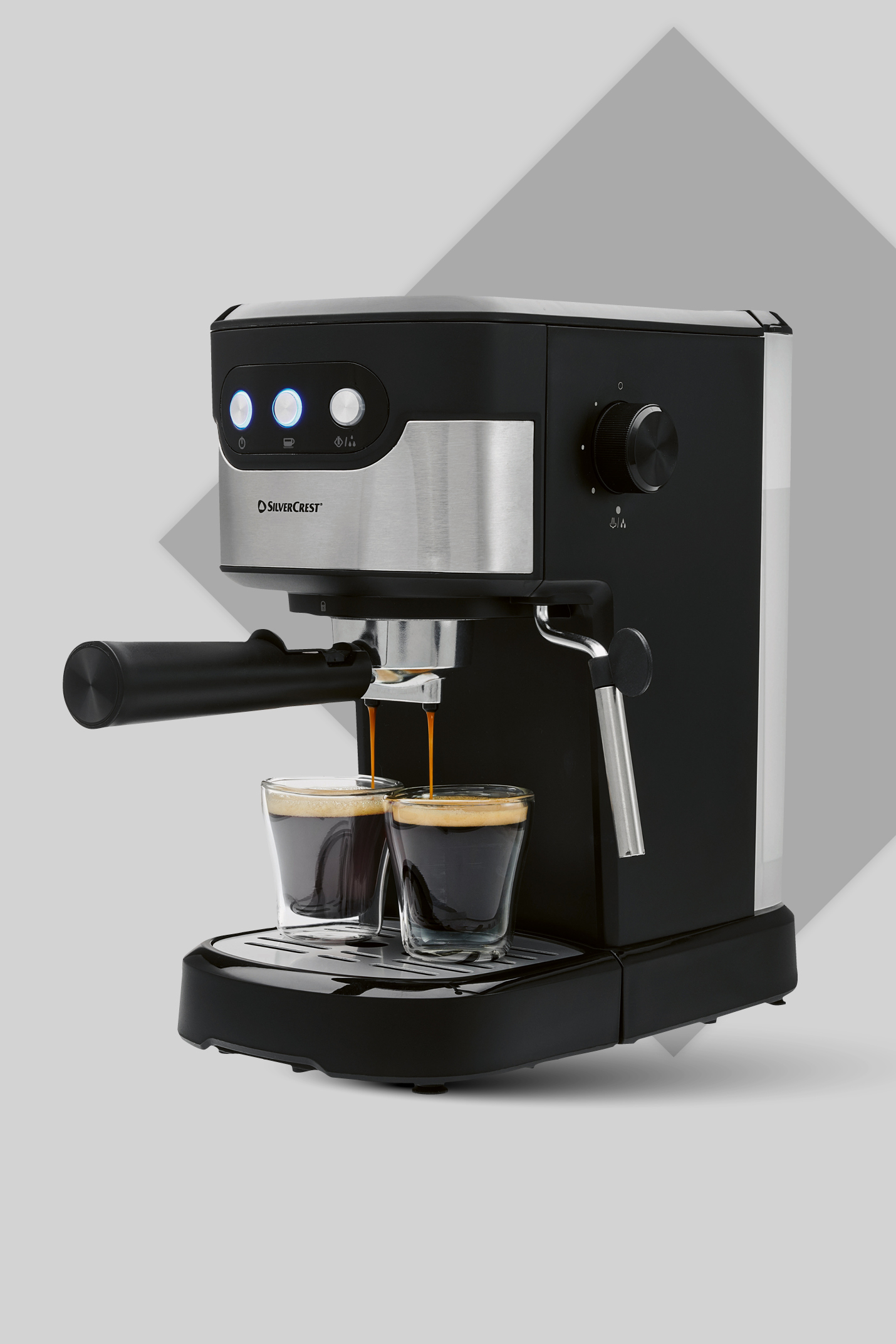 Črni aparat za espresso iz nerjavečega jekla, ki pripravlja kavo v dve stekleni skodelici.